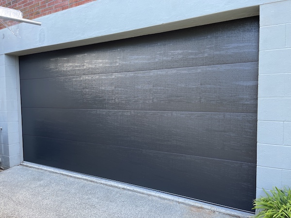 Flat Woodgrain - Sectional Garage Door - Ironsand J2320